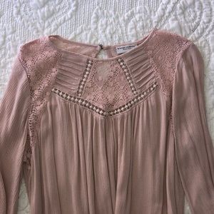 A light pink maternity blouse